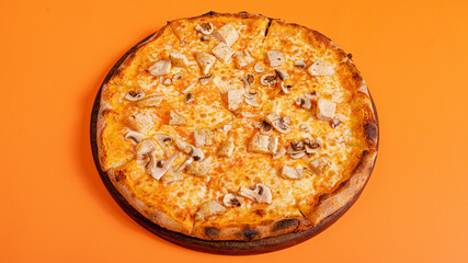 Mushrooms pizza isolated on orange background