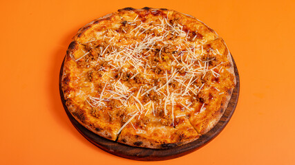 Pizza isolated on orange background