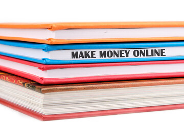 Business concept. MAKE MONEY ONLINE lettering written on a notepad on a light background