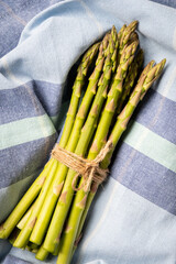 New season fresh asparagus in a bundle tied with string