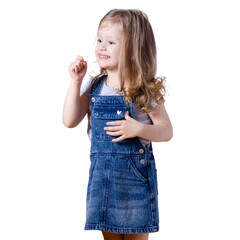 Little girl child in jeans dress looking smiling happiness on white background isolation