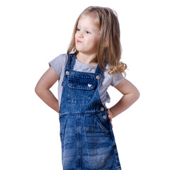 Little girl child in jeans dress looking smiling happiness grimaces on white background isolation