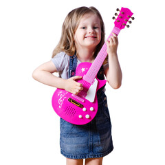 Little girl child in jeans dress looking smiling happiness with toy guitar on white background isolation