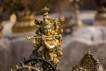 Fototapeta na wymiar A handmade brass idol of Lord Krishna and Goddess Radha is a stunning piece of art that blends craftsmanship with spiritual significance.
