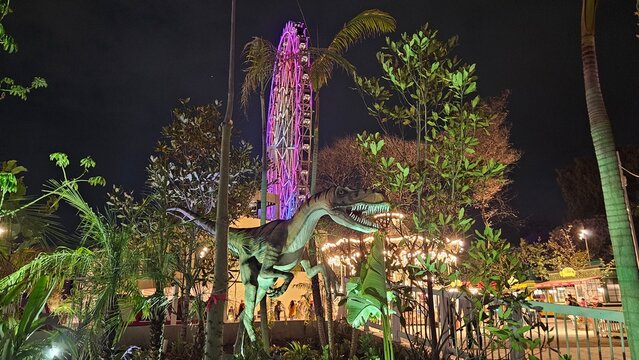 Mexico City, Mexico - Mar 20 2024: Night view of the Aztlan 360 Wheel of Fortune, with colorful lighting in the Chapultepec Forest Urban Park