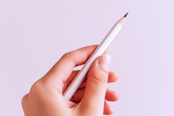 Hand holding a white pencil, business economy financial concept