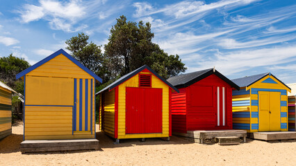 Beautiful bathing houses on white sandy beach at Brighton in Melbourne, Australia. - obrazy, fototapety, plakaty