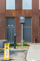 Electric Vehicle Charging Station Outside a Modern Building