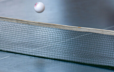 Blurred motion. The dynamic essence of table tennis ping pong. Flying ball over the net. Part of...