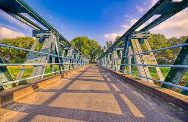 Fototapeta premium Laarbrug bridge crossing the Wilhelminakanaal canal. Village of Aarle-Rixtel, The Netherlands.