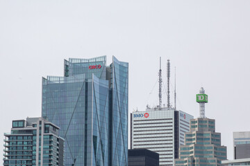 Obraz premium Toronto Canada, May 5, 2022; Downtown Toronto bank towers with bank logos in a row, CIBC, BMO and TD.