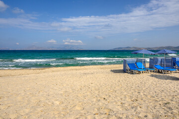 Fototapeta na wymiar Beautiful Marmari beach with golden sand and emerald waters. Kos island, Greece