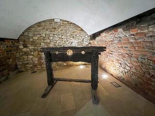 Old stocks - an instrument of torture located in the ruins of the Rabsztyn castle near Olkusz in Poland - 778351187
