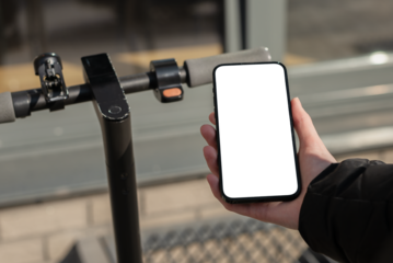 Hand using mobile phone screen mockup, smartphone app for renting kick scooter