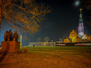 Jasna Gora Monastery in Czestochowa at night. The inscription on the banner in Polish 