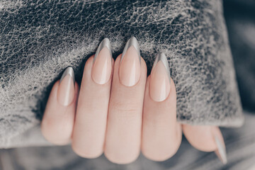 Beautiful art manicure. French manicure design ideas. Nail polish. Silver French nails. Close up...