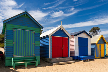 Fototapeta na wymiar Beautiful bathing houses on white sandy beach at Brighton in Melbourne, Australia.