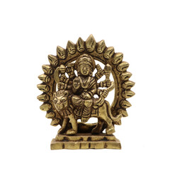 statue of goddess durga devi of hindu religion holding multiple weapons in her many arms, sitting on her lion, handcrafted with details in golden brass isolated in a white background