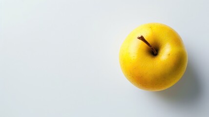 Single yellow apple on a white background.