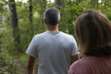 Couple hiking in the forest - 778370903