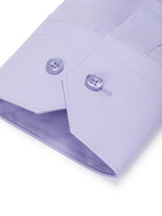 Close-up of a cuff with buttons on a light purple shirt on a white background