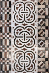 Intricate pattern of multi colored marble floor in ancient Battistero di San Giovanni, Florence, Italy - obrazy, fototapety, plakaty