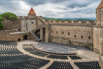 Empty seats in an outdoor theatre for a show in the walled city of Carcassonne in France - 778392742