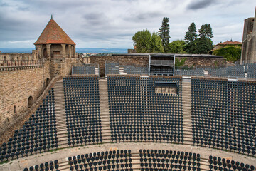 Empty seats in an outdoor theatre for a show in the walled city of Carcassonne in France - 778392768