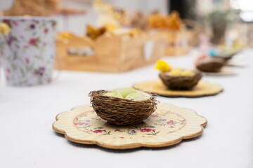 Easter candy table.. Typical Easter sweets on a festive celebration table. There are Easter eggs from the tradition of the Easter bunny and chocolate eggs, cakes and bunnies