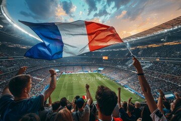 A crowd of people are cheering at a stadium, holding a French flag. Football fans or spectators at the championship