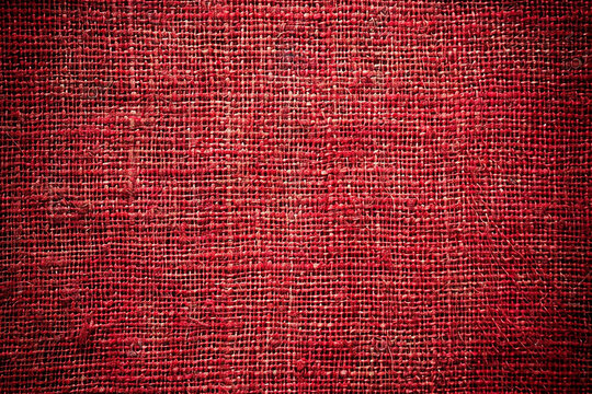 A canvas showcasing a red hessian (jute) fabric texture. 32k, full ultra HD, high resolution