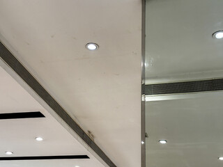 The ceiling is white and has a few lights