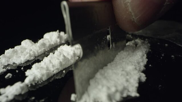 Close-Up of Powdered Drugs and Razor Blade