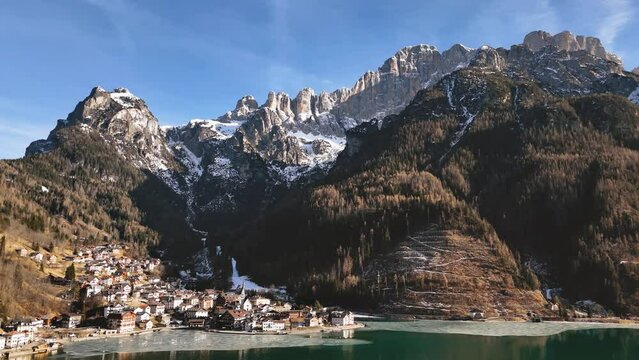 Alleghe village with Monte Civetta in the background on a sunny winter day. Dolomite Alps, Italy