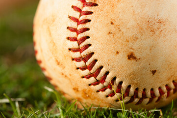 Extreme Close Up of Baseball on Grass
