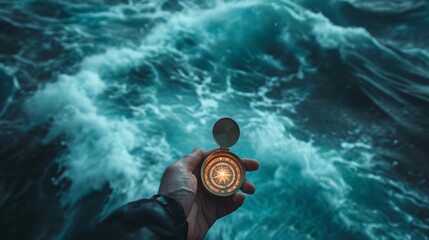 Person hand holding a compass in a stormy sea, emphasizing the significance of maintaining direction and staying on course to avoid getting lost in turbulent situations. Colors: Dramatic stormy blues. - obrazy, fototapety, plakaty