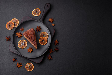 Delicious fresh cheesecake cake or snickers with cream and nuts on a ceramic plate