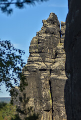 tall rock in saxon switzerland, perfect for rock climbing - obrazy, fototapety, plakaty