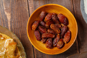 Dates in a plate on the festive table of Ramadan Iftar. Horizontal