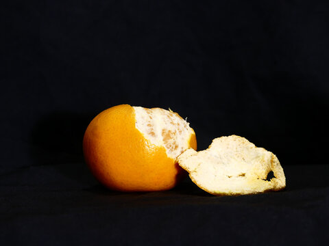 Fresh tangerines with peel on black background stock photo