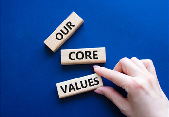 Our core values symbol. Concept words Our core values on wooden blocks. Beautiful deep blue...