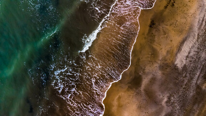 Top view of the seashore and waves