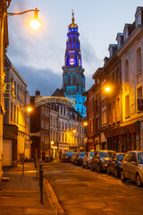 Arras, France - december 30 2023 : Vertical view over the illuminated Belfry from the street, photography taken during the Christmas holidays