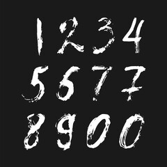 Set of calligraphic numbers painted by white brush on isolated black background. Lettering for your design. Vector illustration.