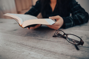 Woman reading holy book, hands close up. stock photo