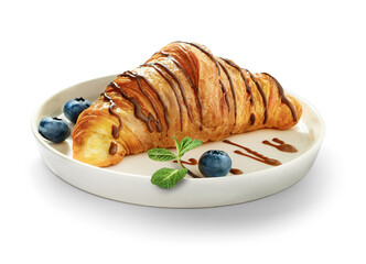 Croissant with chocolate topping and blueberry on serving plate isolated on white background