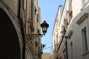 Old fashioned street lamp in a street of Bari, Apulia, Italy.