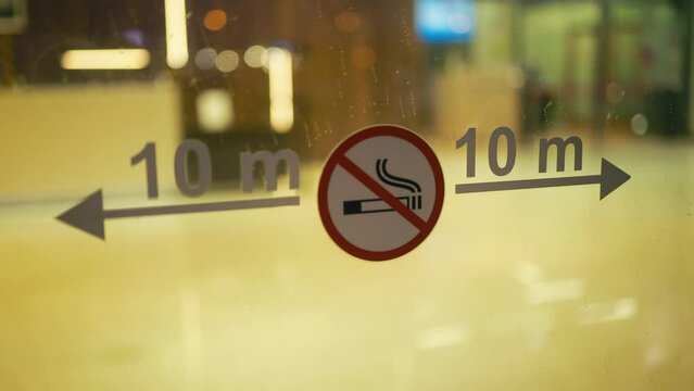 No smoking sign on a window in a shop