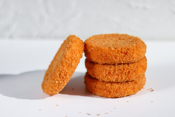 A stack of fried camembert on white background