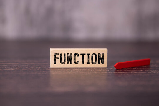text on gray word function in small wooden letters with black font on a blue background